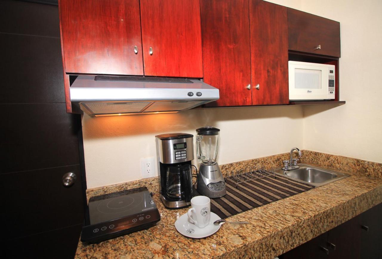 Papagayo Hotel Boutique Плая-дель-Кармен Экстерьер фото A coffeemaker in a kitchen